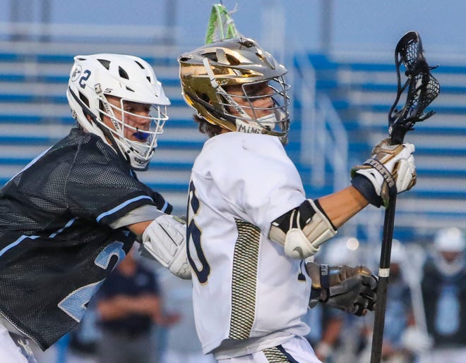 Cape Henlopen's Henry D'Ambrogi defends against Salesianum's Kaleb Russell in the first half of the DIAA state tournament championship game Thursday, May 27, 2021 at Dover High School.