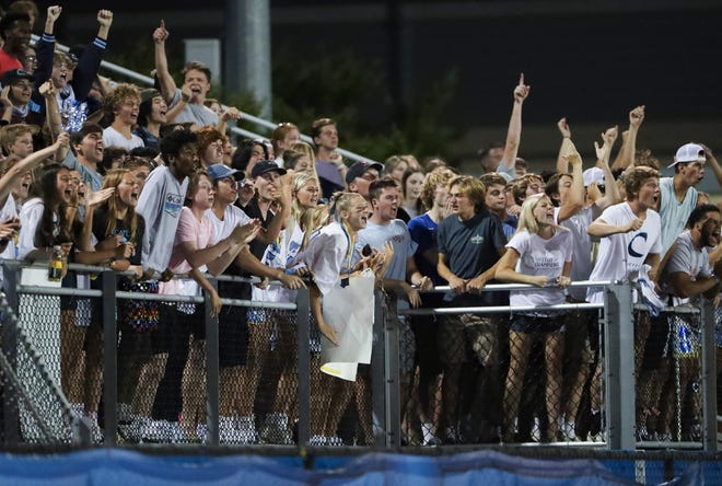 Cape Henlopen students cheer for their classmates as the Vikings make a late surge to try to even the score late in the second half of Salesianum's 12-10 win in the DIAA state tournament championship game Thursday, May 27, 2021 at Dover High School.