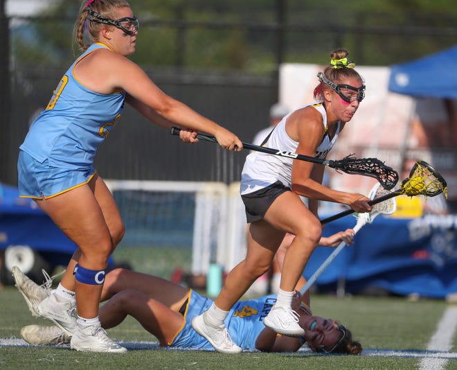 Cape Henlopen's Riley Keen (left) and Elizabeth Rishko (bottom) try to stop Tatnall's Lydia Colasante in the first half of the DIAA state tournament title game Thursday, May 27, 2021 at Dover High School.