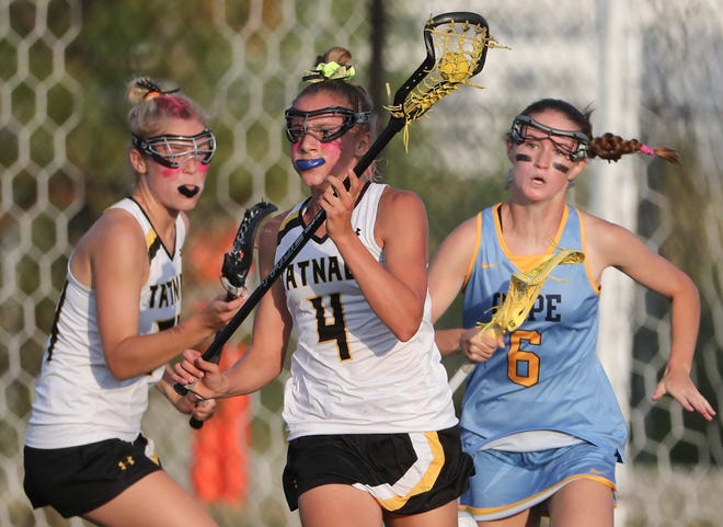 Tatnall's Olivia Carpenter lets teammate Lydia Colasante past her as she is being pursued by Cape Henlopen's Louise Rishko in the second half the Vikings' 17-10 win in the  DIAA state tournament championship game Thursday, May 27, 2021 at Dover High School.