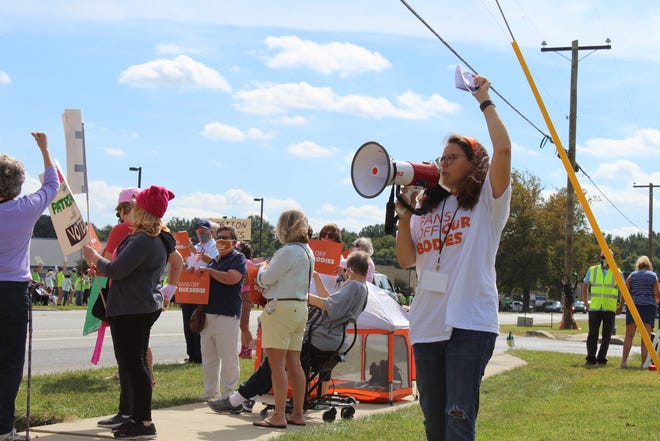 Activists supporting reproduction rights joined the Women's March in Seaford on Saturday, Oct. 2, 2021, outside the site of a new Planned Parenthood clinic. On the other side of the highway were many counter protesters in opposition to abortions and Planned Parenthood.