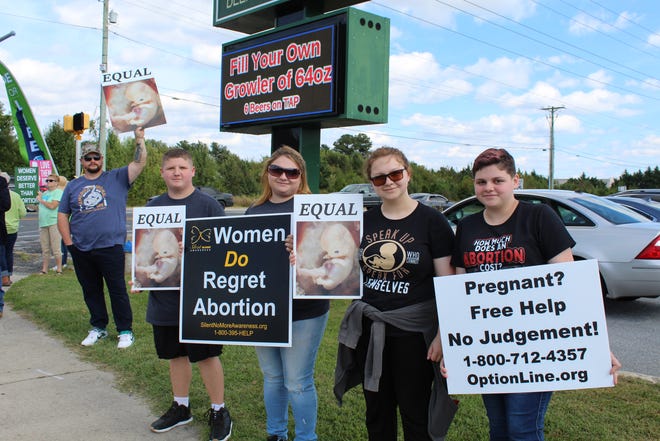 The Mitchell family from Dagsboro joined counter protesters in opposition to abortions and Planned Parenthood in Seaford Saturday, Oct. 2, 2021.