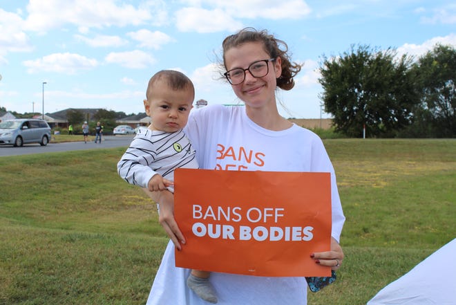 Rebecca Payne with her baby Henry Colona-Payne is a Seaford resident who wanted to show support for Planned Parenthood and access to abortions on Saturday, Oct. 2, 2021.