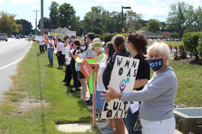 Activists supporting reproduction rights joined the Women's March in Seaford on Saturday, Oct. 2, 2021, outside the site of a new Planned Parenthood clinic. On the other side of the highway were many counter protestors in opposition to abortions and Planned Parenthood.