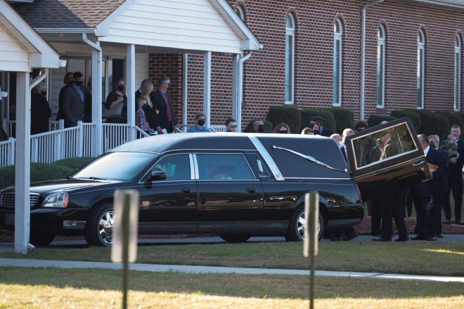 The body of former Gov. Ruth Ann Minner is moved to a hearse for transport to Slaughter Neck Cemetery after Minner's memorial service Wednesday, Nov. 10, 2021, at Milford Church of the Nazarene.
