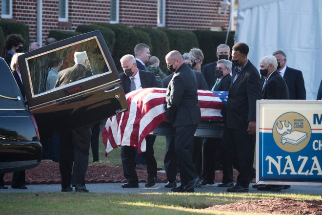 The body of former Gov. Ruth Ann Minner is moved to a hearse for transport to Slaughter Neck Cemetery after Minner's memorial service Wednesday, Nov. 10, 2021, at Milford Church of the Nazarene.